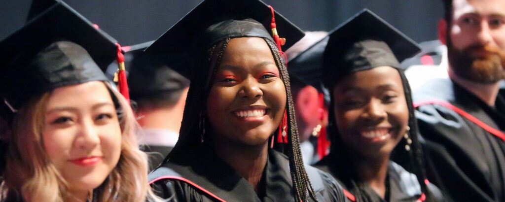 Smiling students at graduation